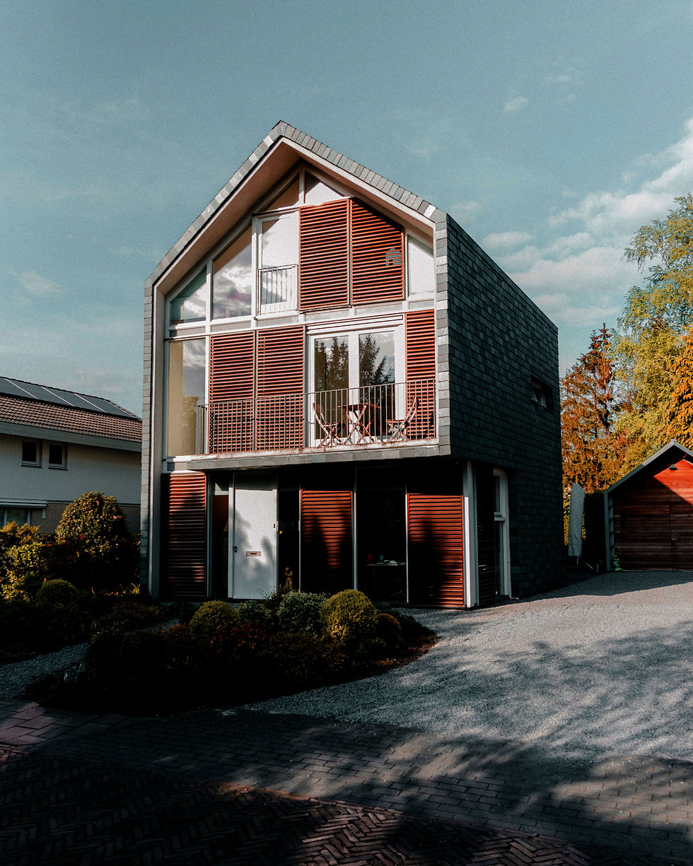 Modern house design, contemporary architecture, two-story house, slanted roof, red facade