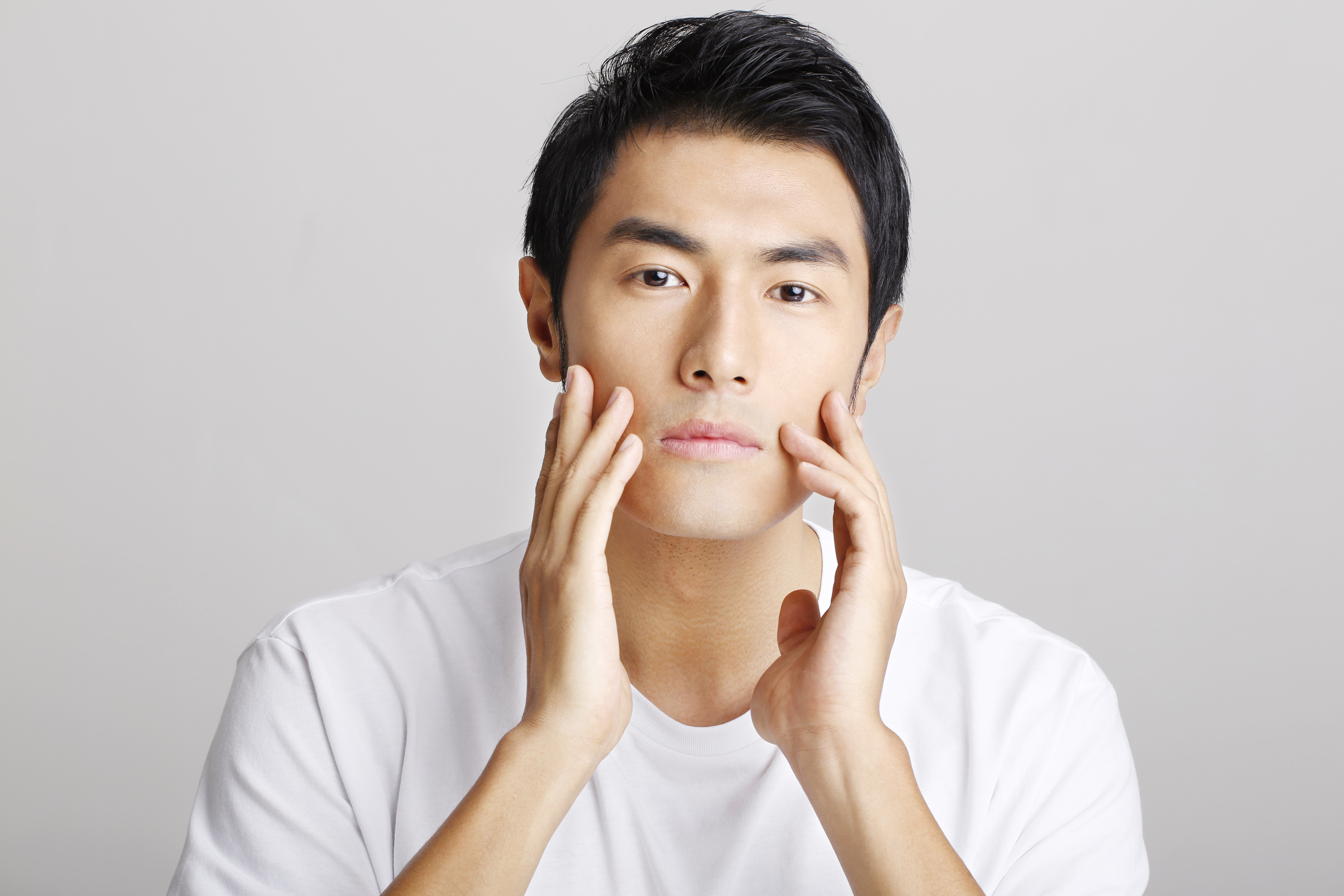Man Touching Face