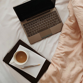 Coffee and Laptop in Bed