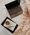 Coffee and Laptop in Bed