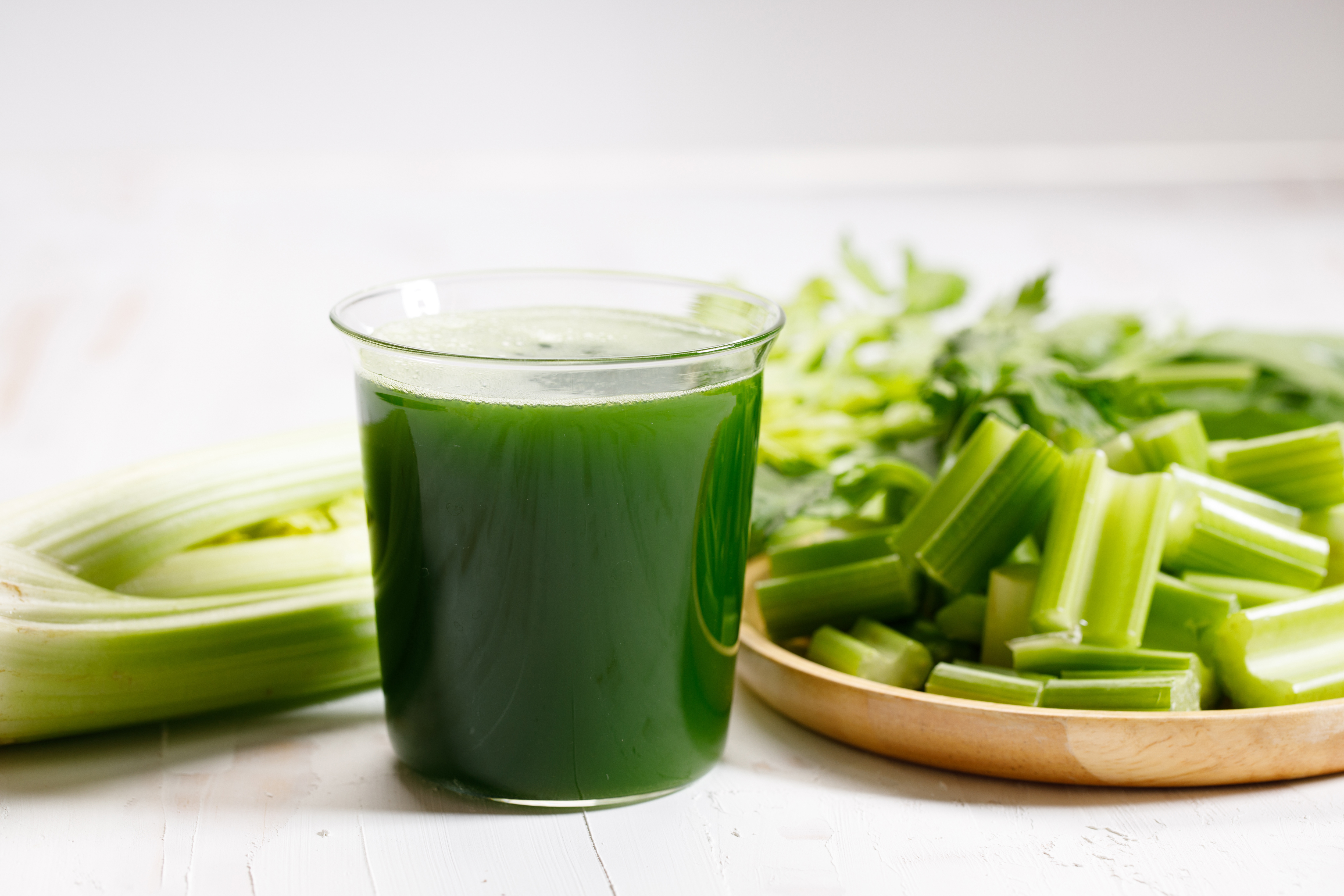 Green Juice on table next to celery