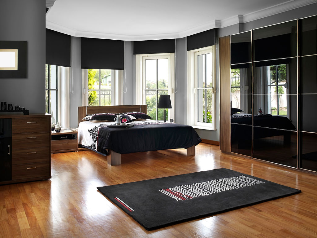 Spacious bedroom with wooden floors