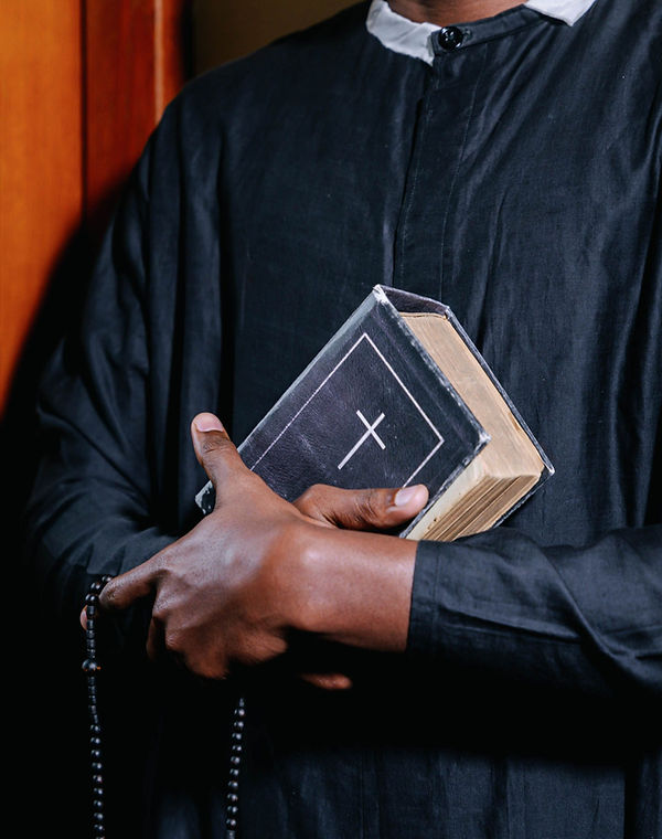 Clergy Holding Bible