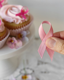 Cupcakes with pink frosting and a pink ribbon