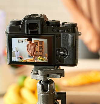 Woman filming her cooking process