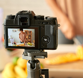 Woman filming her cooking process