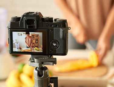 Woman filming her cooking process