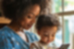 Mother And Child looking at a cell phone