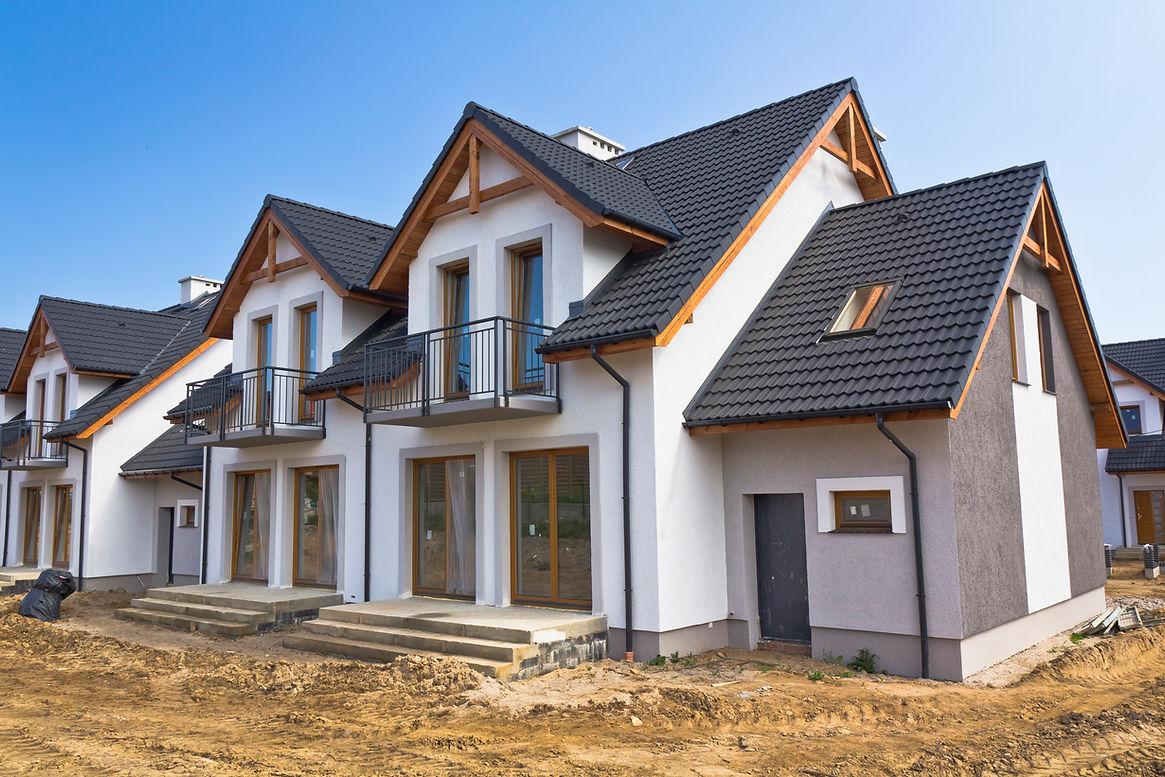 New Residential Home under construction against blue skyS