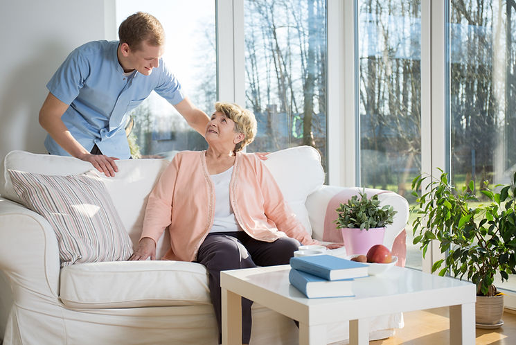 Male nurse caring about patient at home