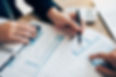 Businesspeople reviewing financial charts and graphs