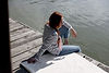 Woman Sitting by Water