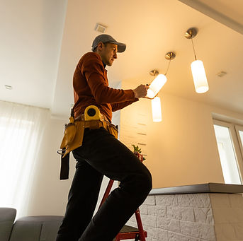 Electrician Fixing Light