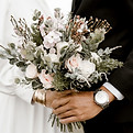 Wedding couple holding bouquet