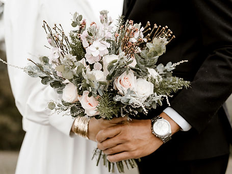 Couple Holding Bouquet