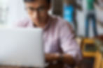 man focused on computer
