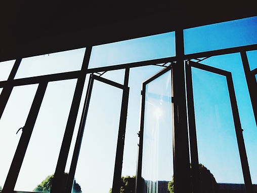 silhouette of window and blue sky
