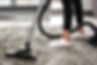 Close-up of a vacuum cleaning a carpet