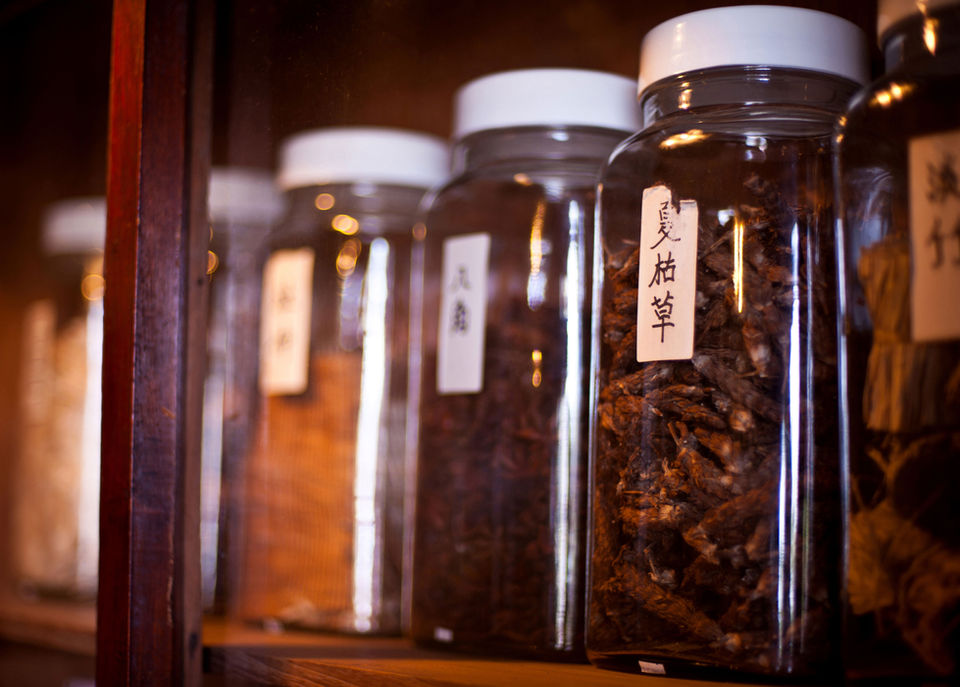 Some jars of herbs with Chinese labels
