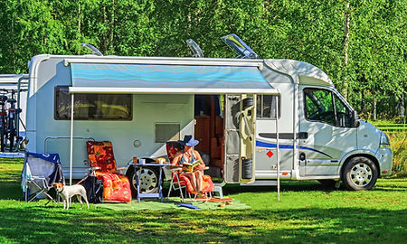 Motorhome camping in campground summertime