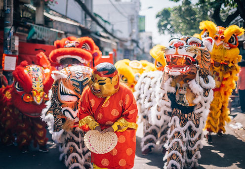 Crowd and lion dancers in the celebration of the chinese New Year in Ho Chi Minh City, Vie