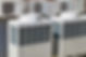 Large air conditioners outside next to an office building