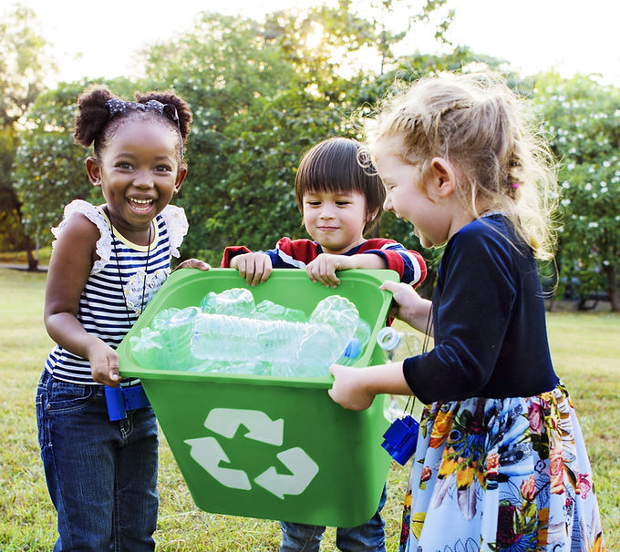 Girls Carrying a Recycling Bin
