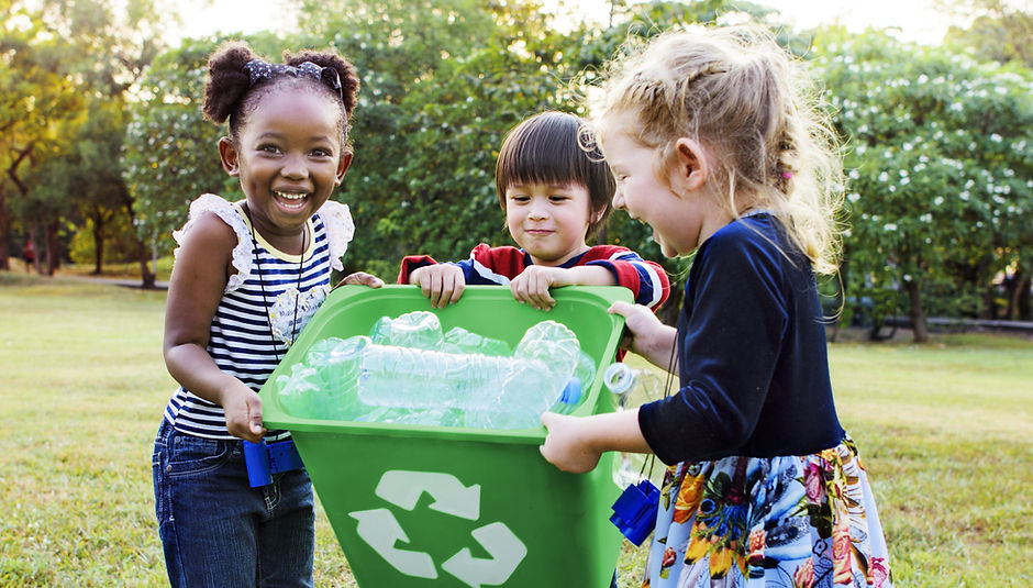 Girls Carrying a Recycling Bin