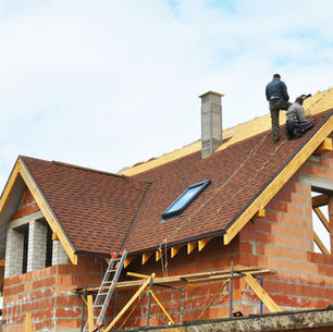 rofessional roof replacement process in Allegheny County showing crew installing new shingles on Pittsburgh area home