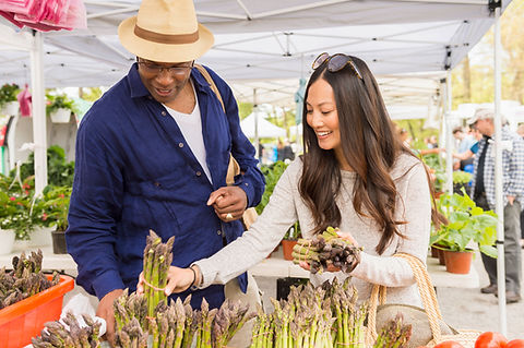 Couple Buying Asparagus