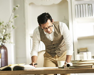Person Looking At Documents In Office
