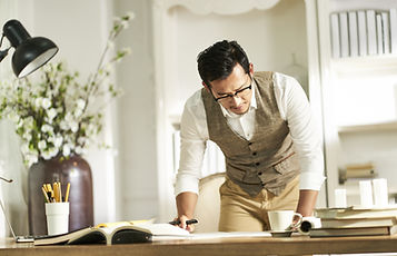 Person Looking At Documents In Office