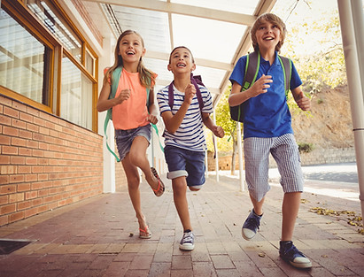 Children running at school