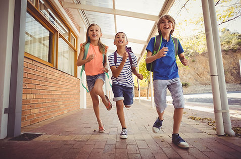 Children running at school