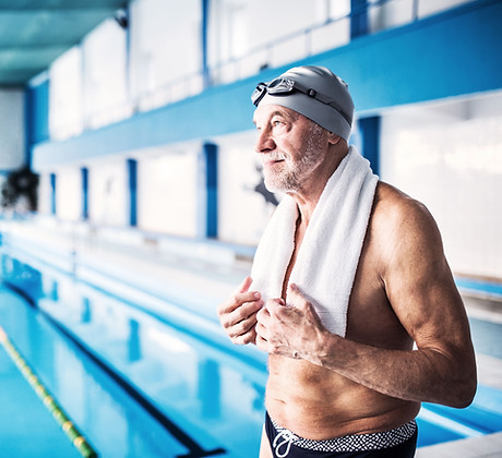 A senior man by the swimming pool