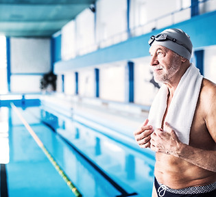 A senior man by the swimming pool