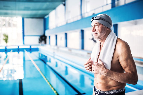 A senior man by the swimming pool