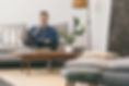 Young man drinking coffee at home