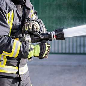 Firefighter Spraying Hose