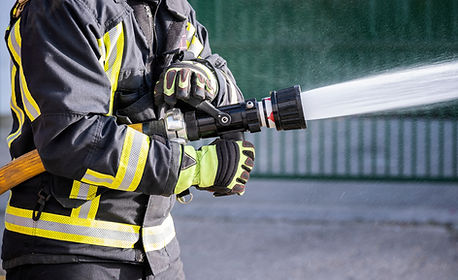Firefighter Spraying Hose