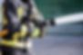 Firefighter Spraying Hose