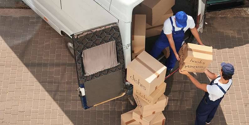 Professional removalist loading a moving box into a truck in Perth