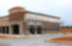 A commercial space under construction with scaffolding