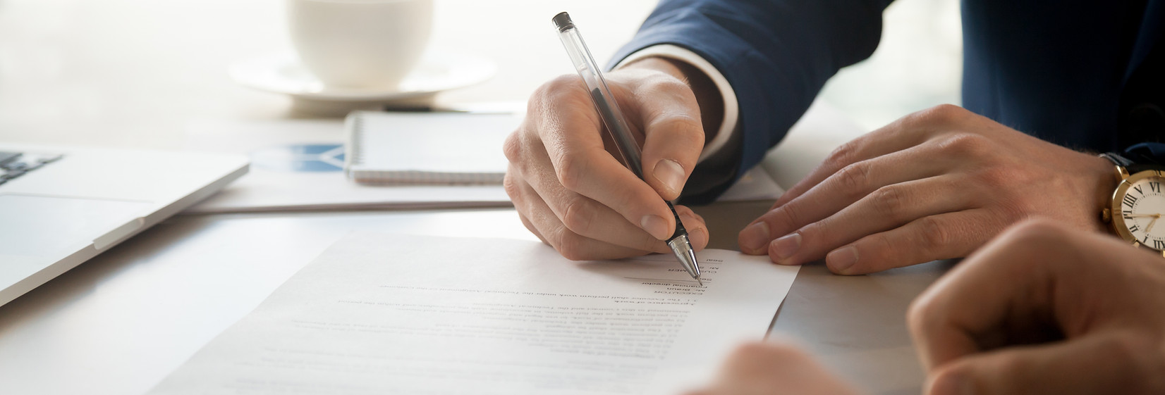 Man in Suit Signing