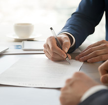 Man in Suit Signing