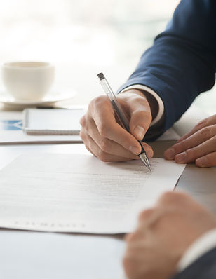 Man in Suit Signing