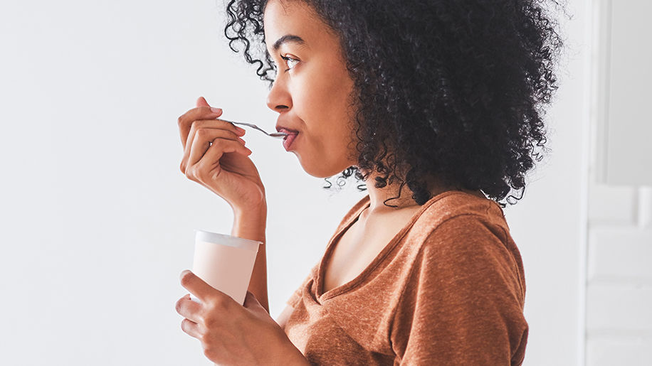 Woman Eating Yogurt