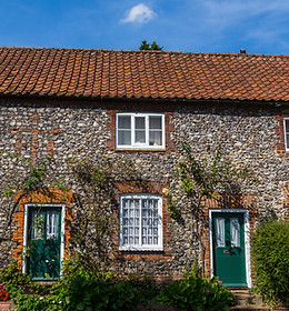 Traditionally built stone terrace houses seen in the rural Norfolk village of Castle Acre