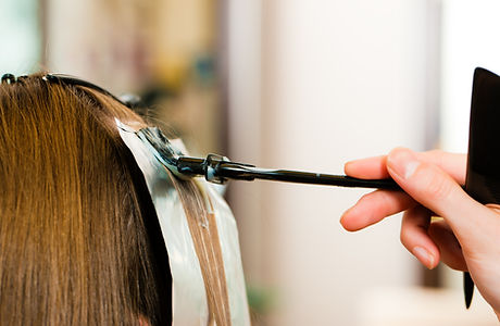 A woman getting her hair coloured