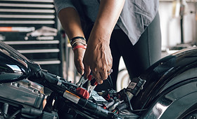 Mechanic Repairing Motorcycle